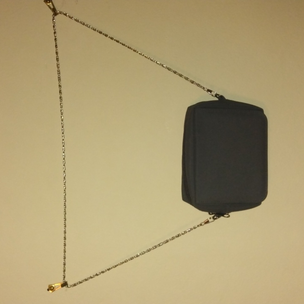 Selling a Mary Kay Nylon gray purse with silver tone chain